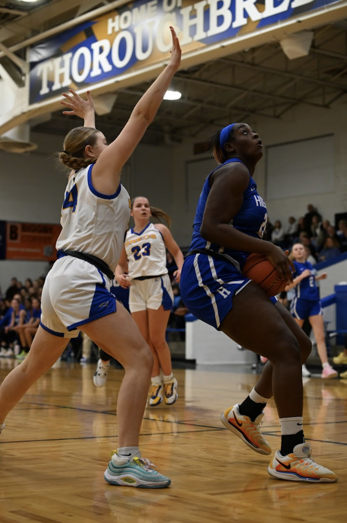 Ty Berry (12) drives to basket for an easy layup. 